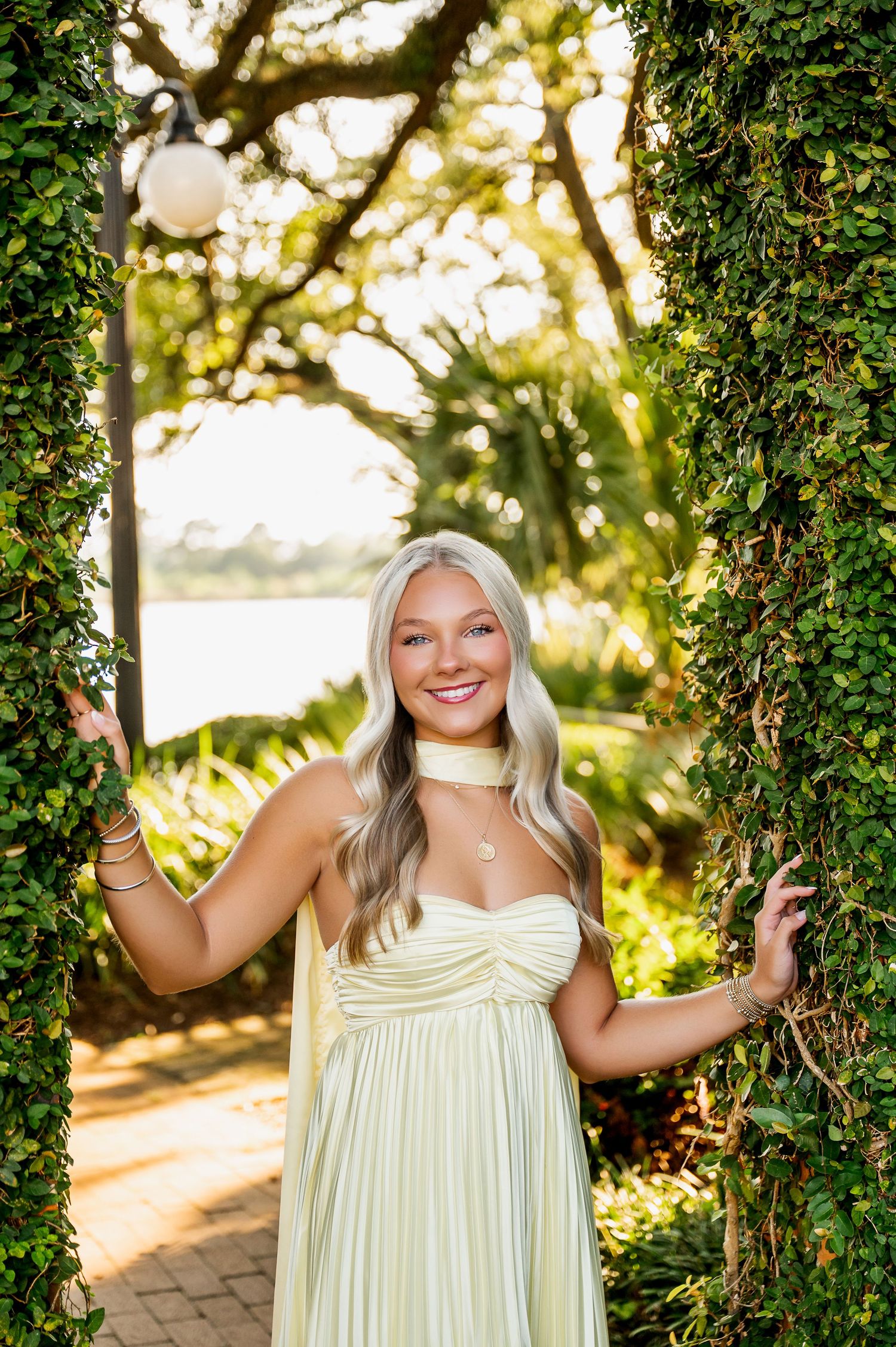 Pale yellow sundress captured in garden setting with natural backlight.