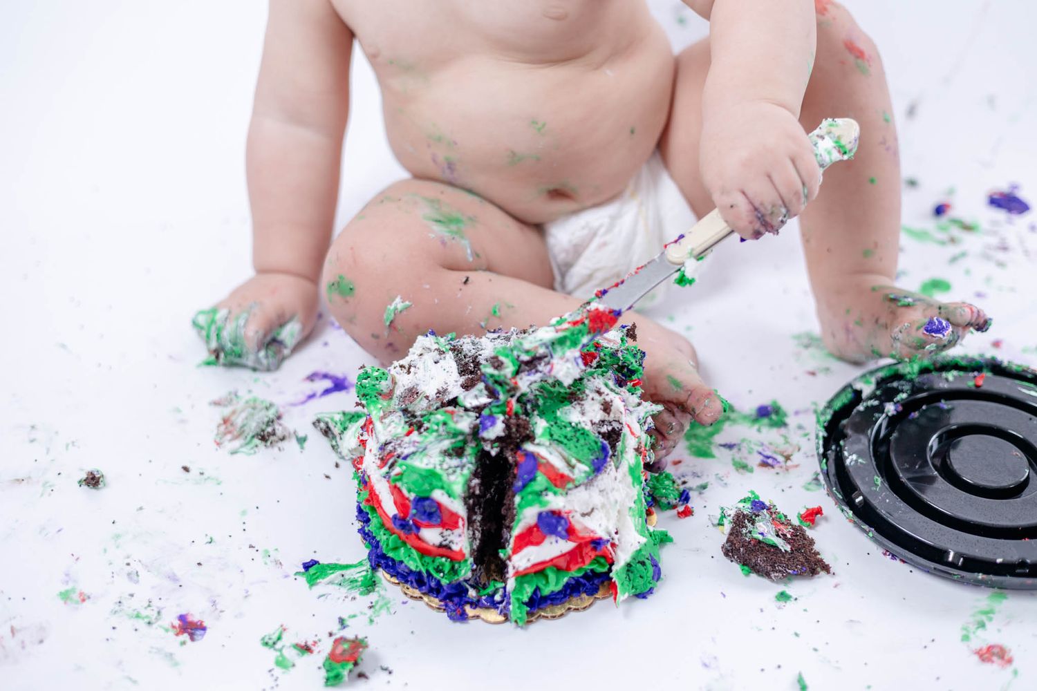 One year cake smash photography. Michigan children's photographer. Central Michigan family pictures. Mid Michigan baby photos.
