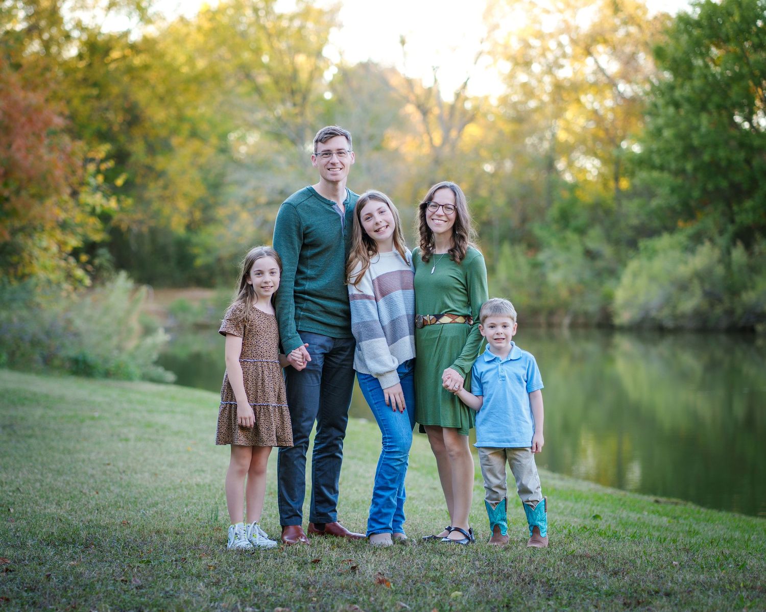 family photo session Colleyville nature center TX natural light orange trees fun pose matching outfits