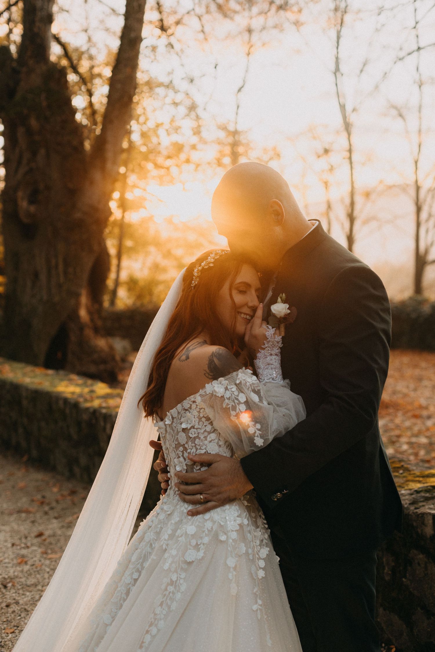 Wedding guests shower the newlyweds with confetti during an outdoor ceremony celebration.