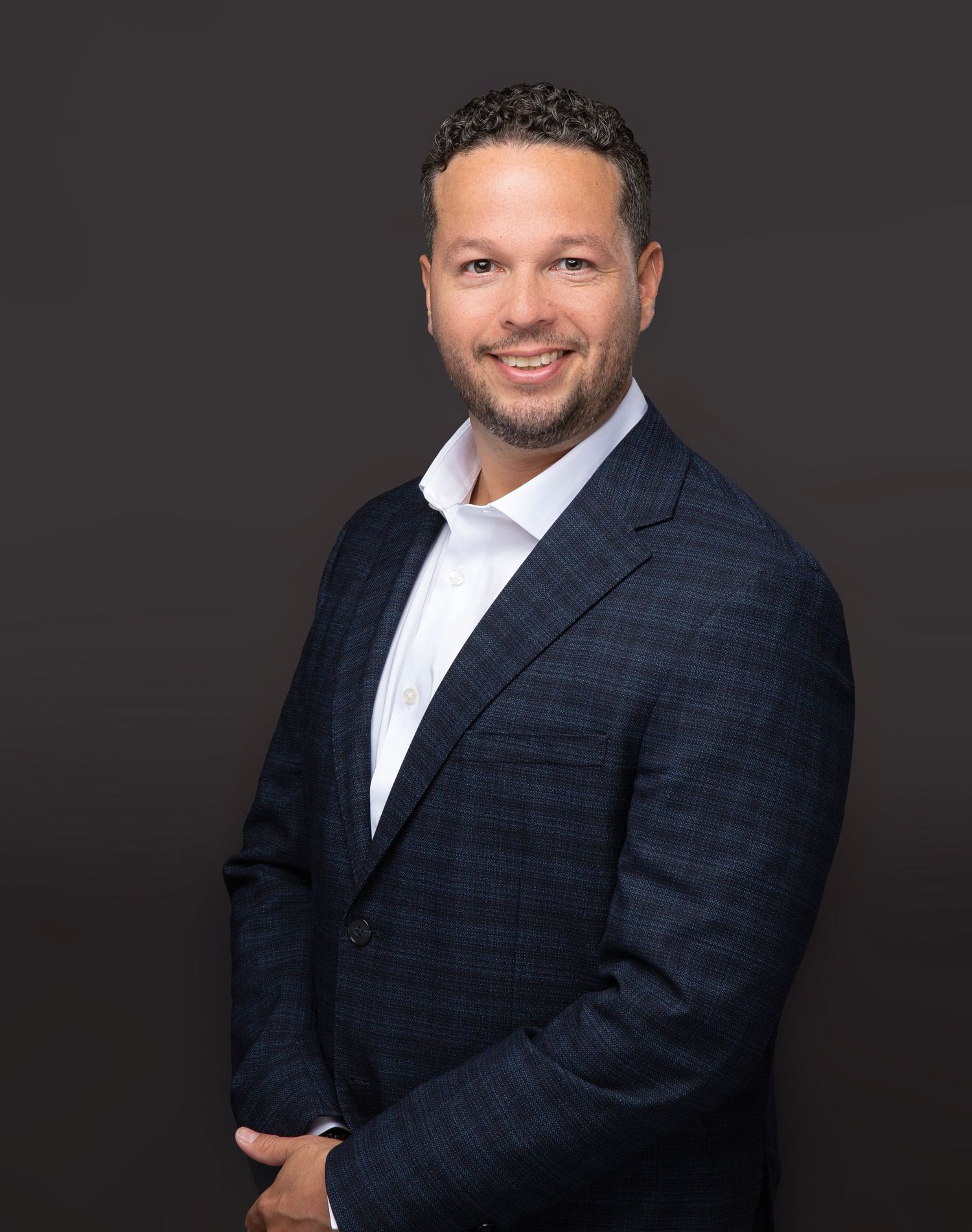 Professional headshot of a man in a navy suit, men's headshots in Sarasota and Bradenton