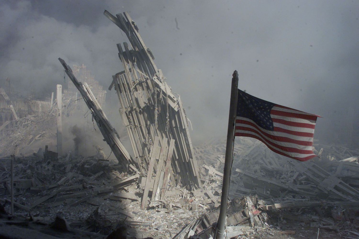 An American flag near the base of the World Trade Center after the attacks of September 11, 2001. | Peter Morgan/Reuters