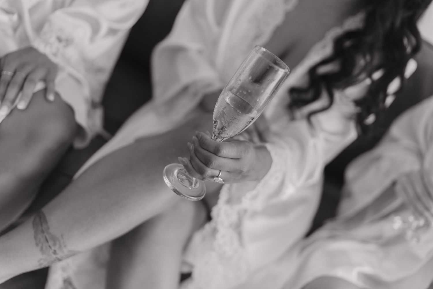 Bride holding a glass of champagne during their Riviera Maya destionation wedding.