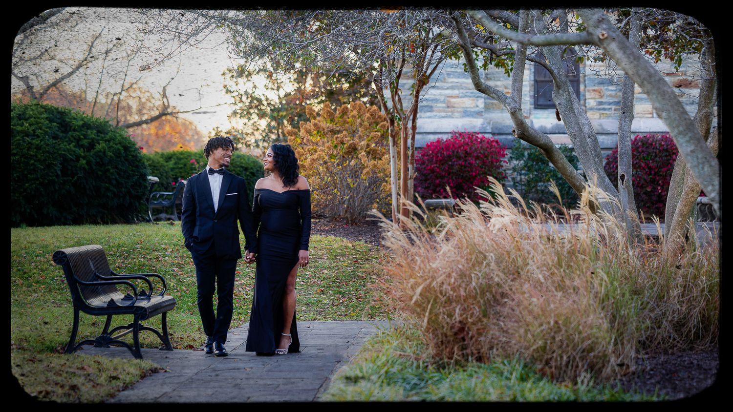 Scenic garden pathway with ornamental grasses and autumn foliage creates a peaceful walking trail.