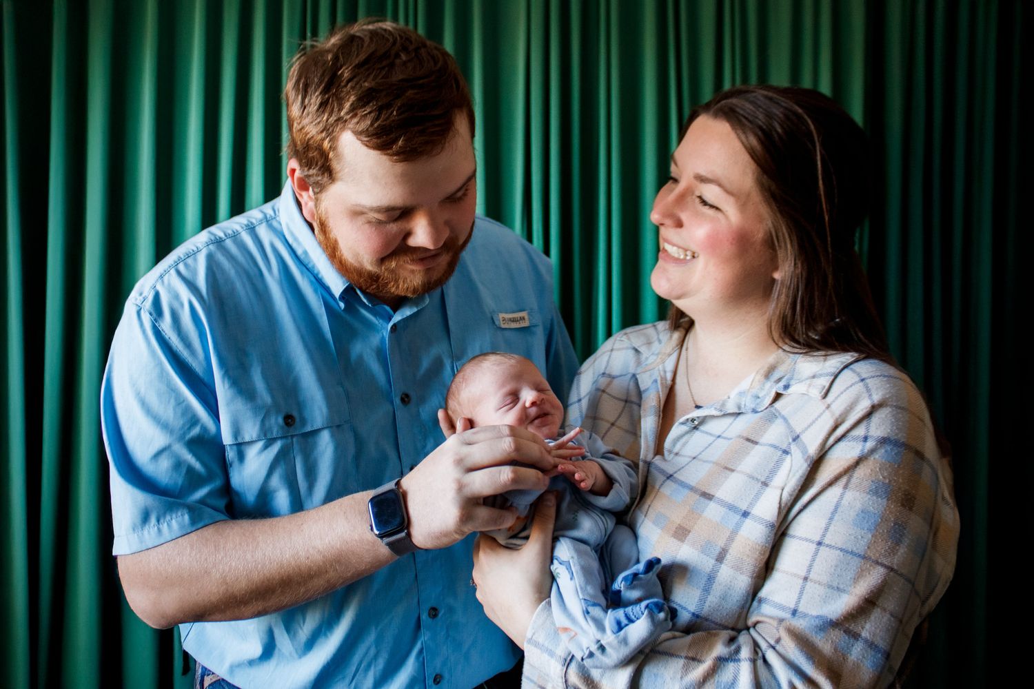 A family of three during a newborn photo session in Amarillo, Texas