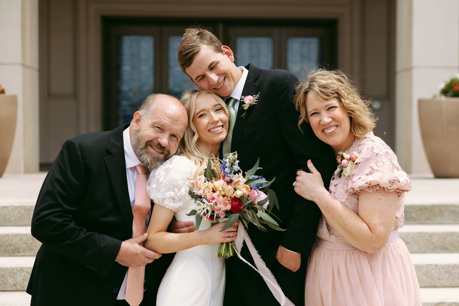 Family Photo with Happy Bride and Elegant Groom using Shot List on Wedding Day