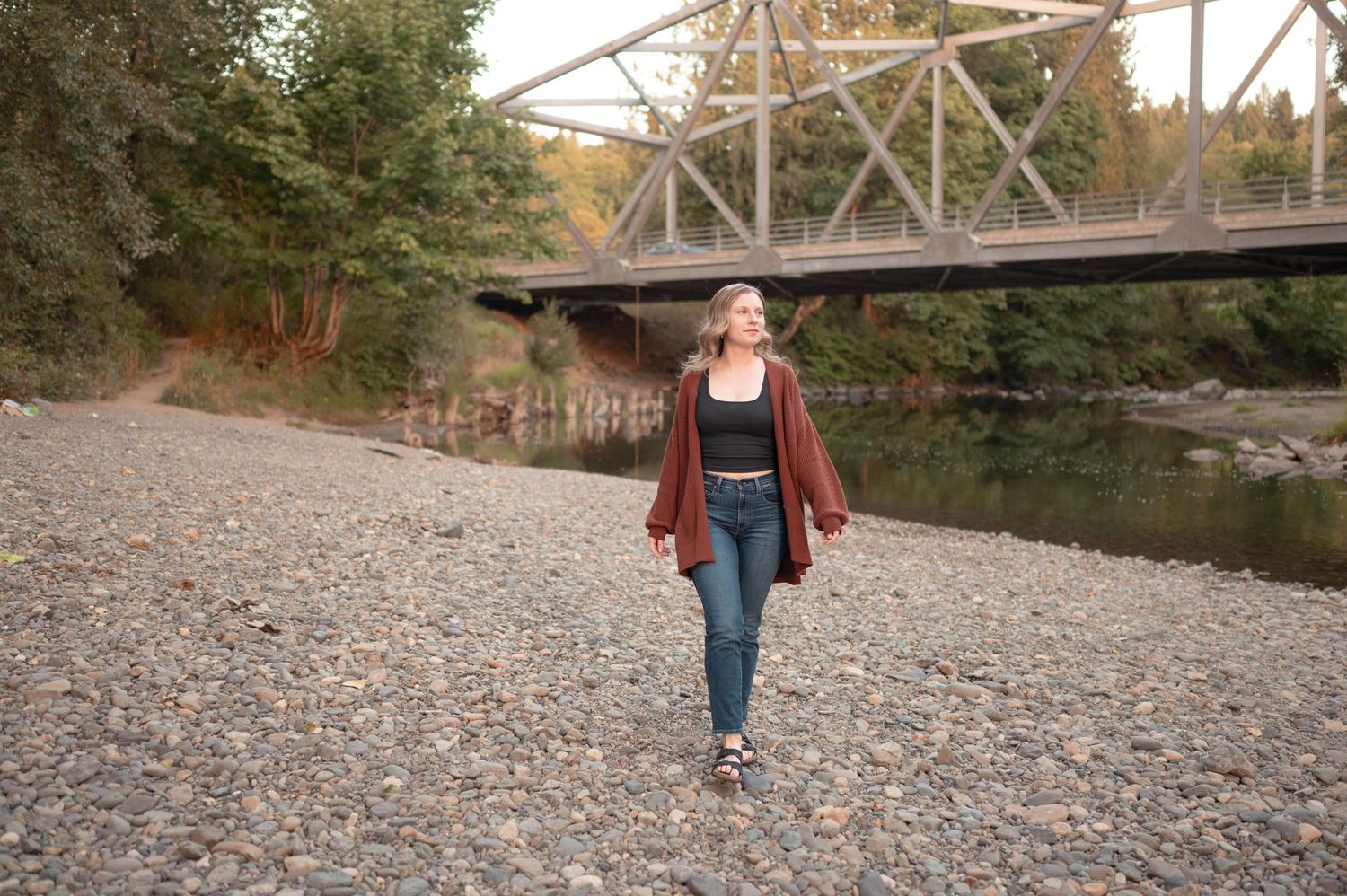 Series of outdoor photos taken near a rustic bridge and rocky riverbank.