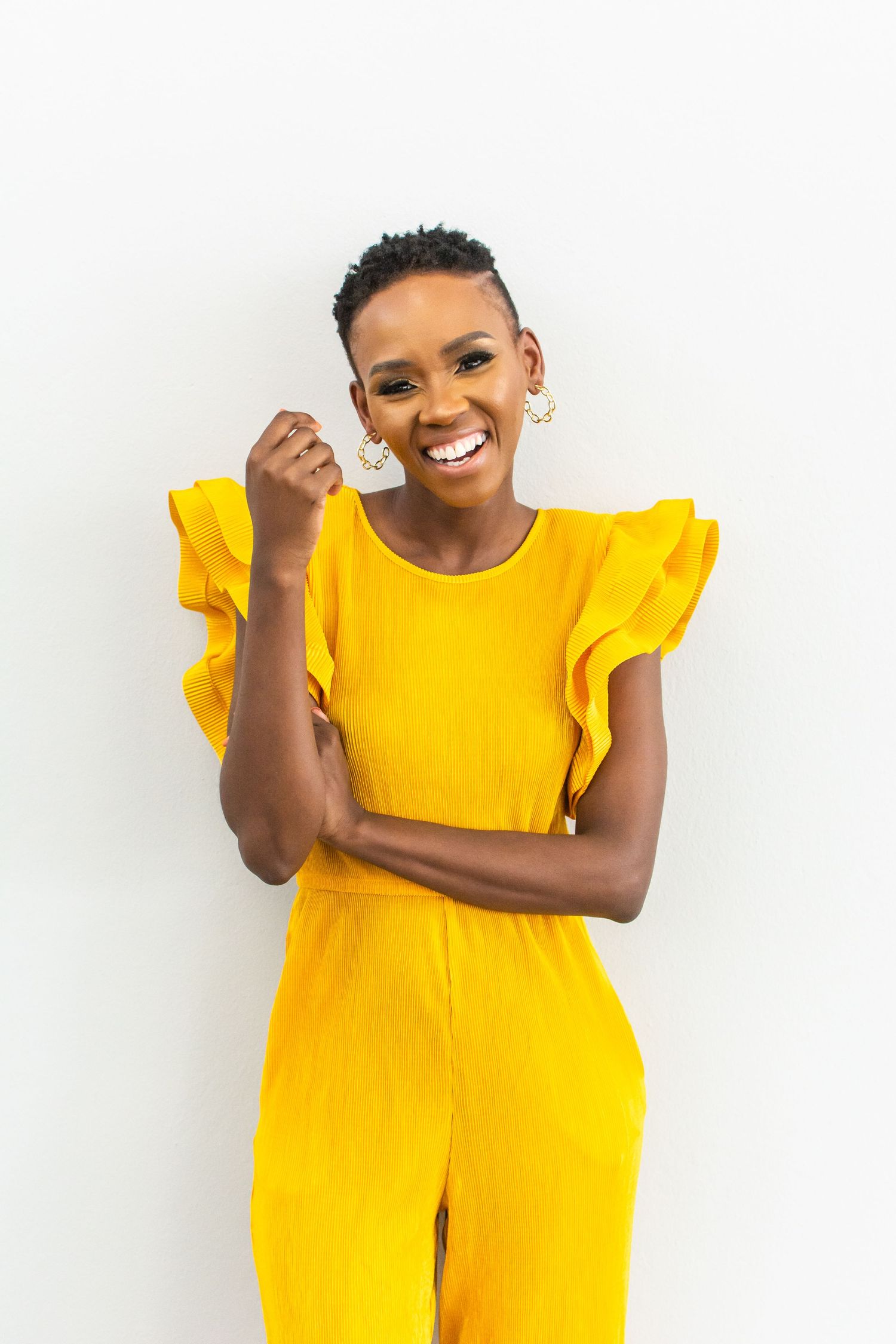 Interior designer wearing yellow jumpsuit