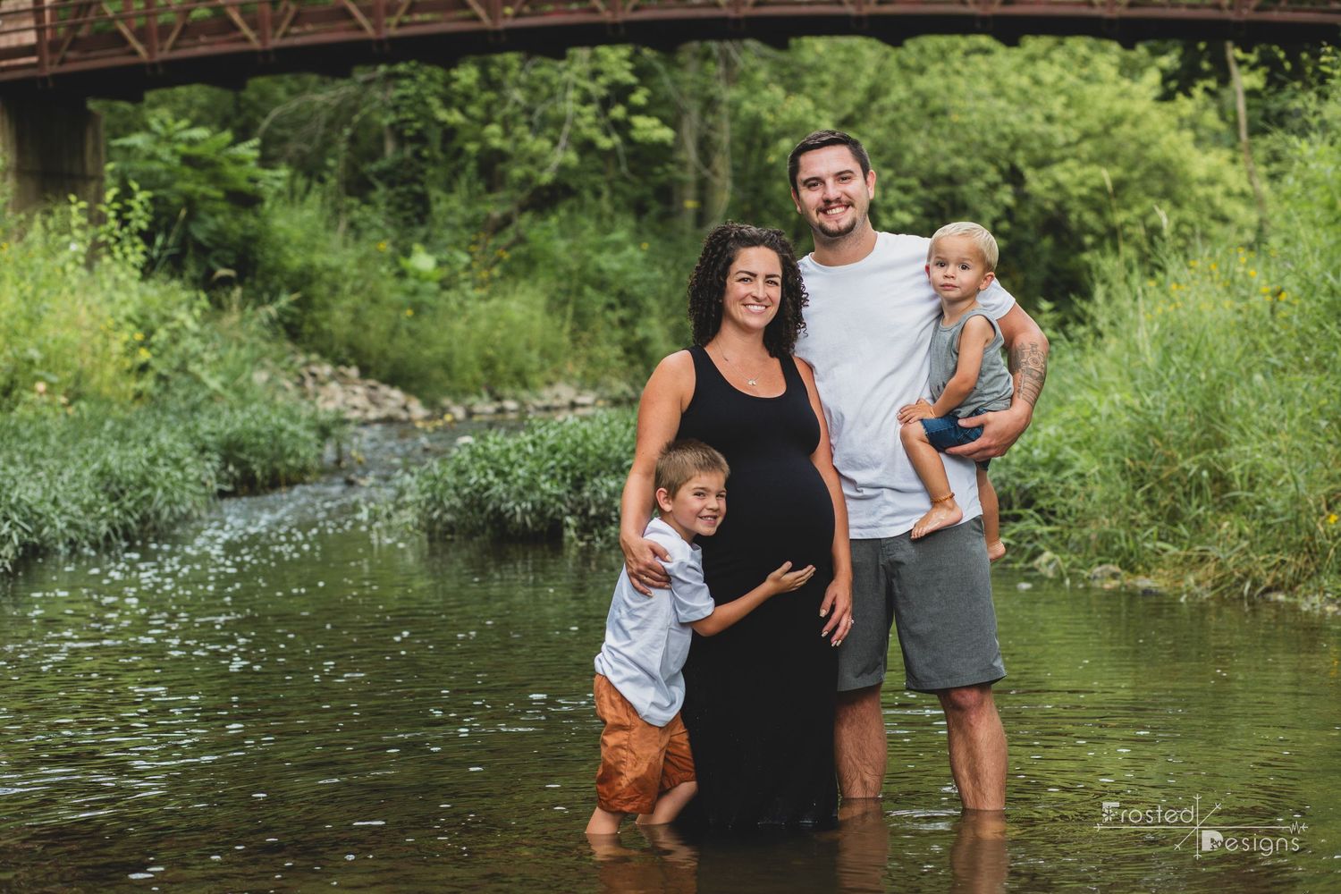 Maternity photography session in Brownsburg, Indiana at Arbuckle Acres Park in the creek.  Family of 4 soon to be 5.