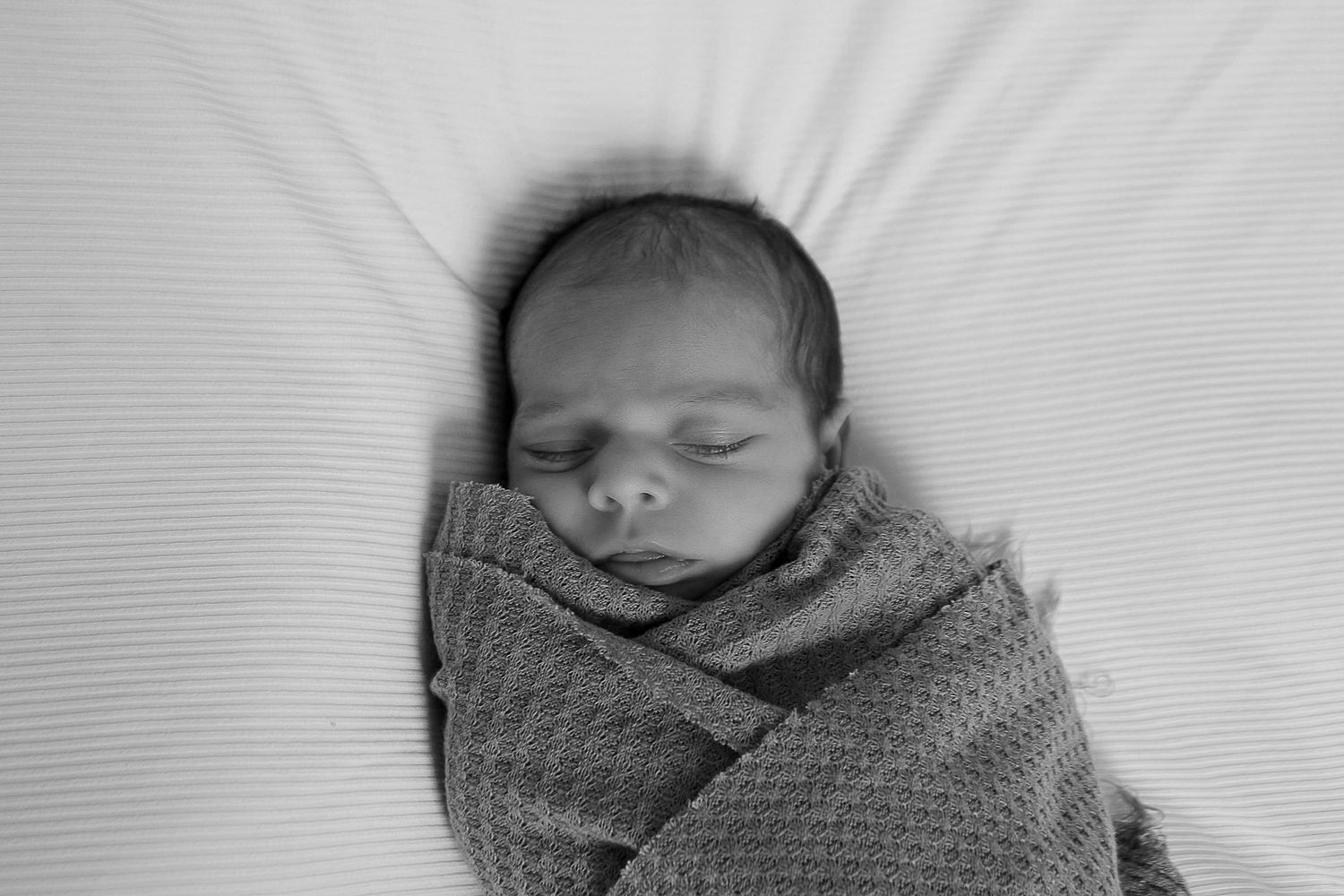 A baby girl during a newborn photo session in Amarillo, Texas