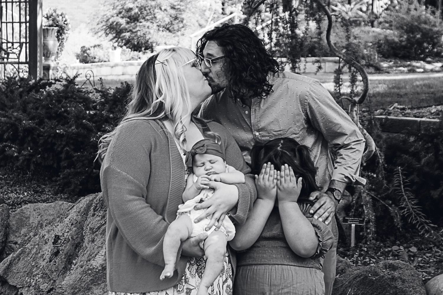 Family of four during a family photo session at the Botanical Gardens in Amarillo, Texas