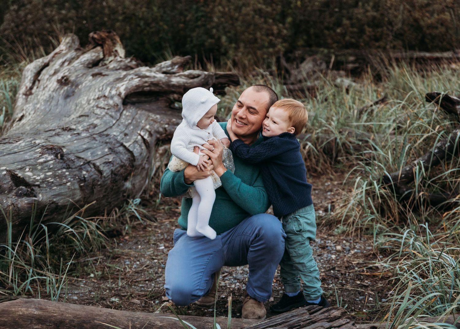 A romantic outdoor photoshoot sequence and embrace among trees and nature during golden hour lighting.