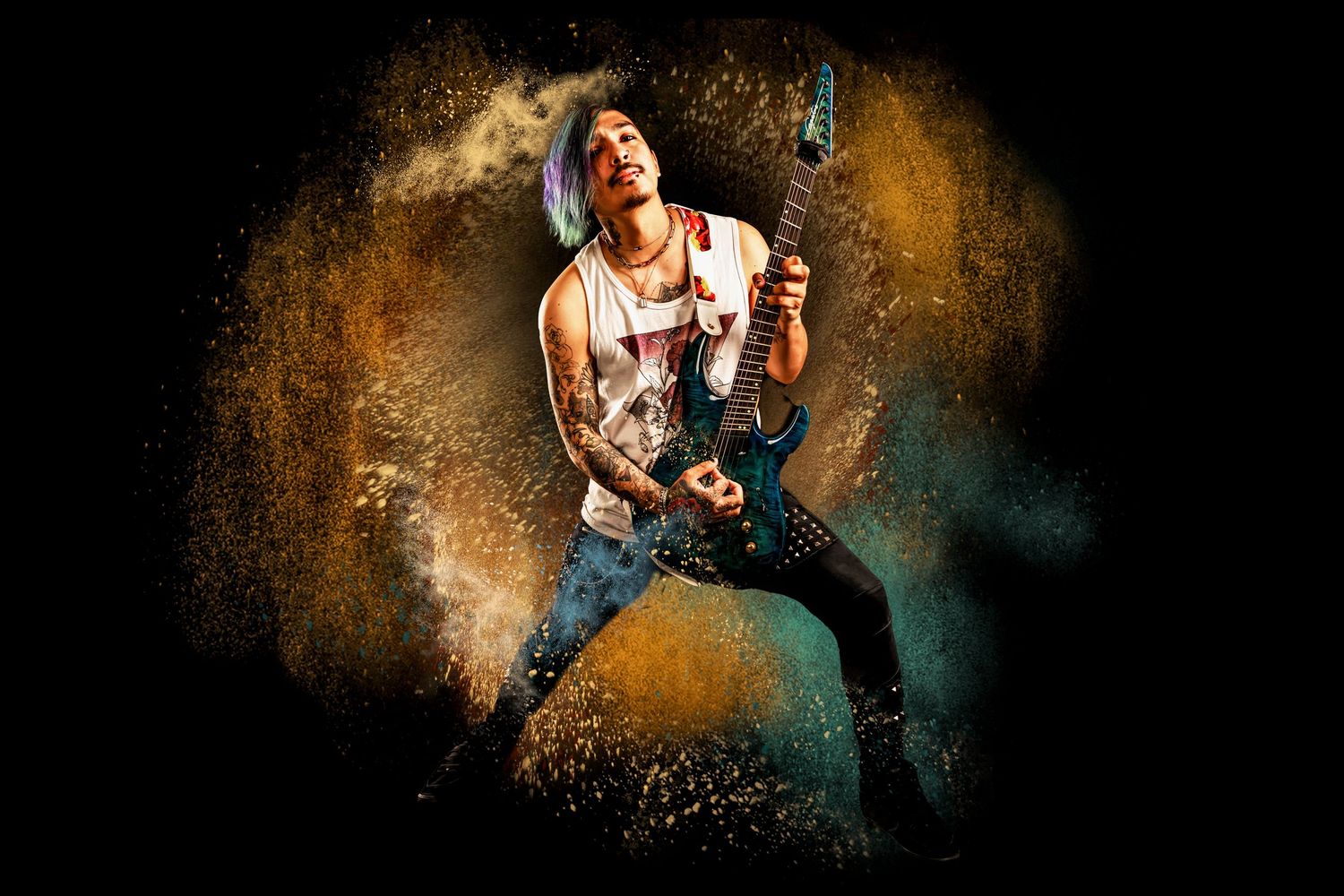 Dramatic portrait of a rock musician playing electric guitar against a textured dark background with golden lighting effects.