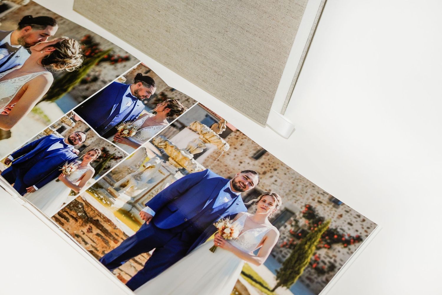 Open photo album displaying wedding photographs with blue and white color scheme.