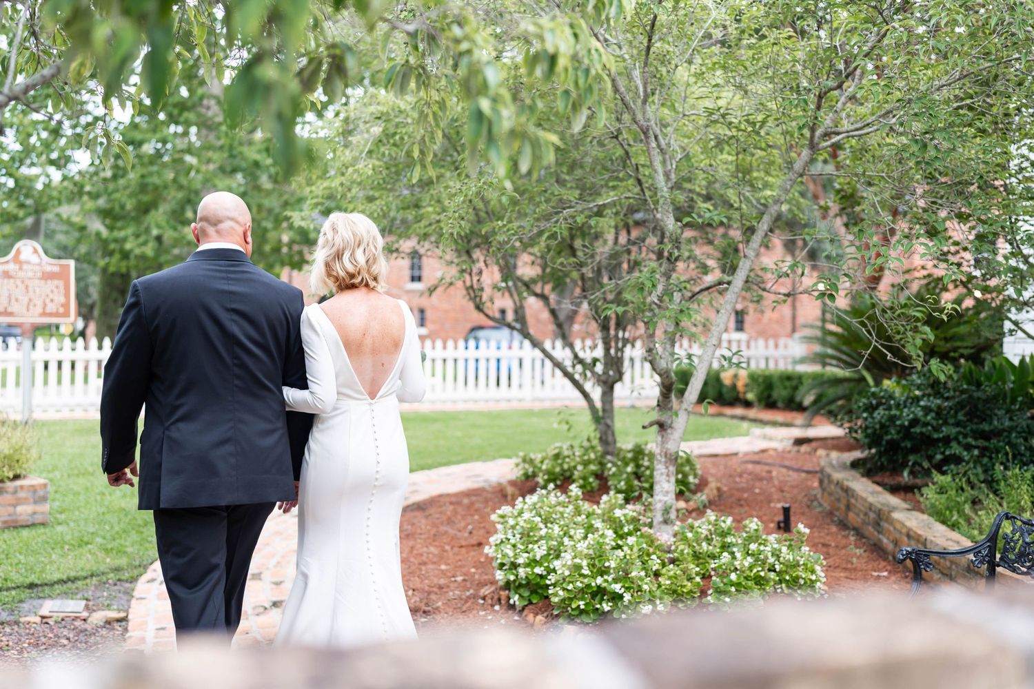 bride and groom walk away