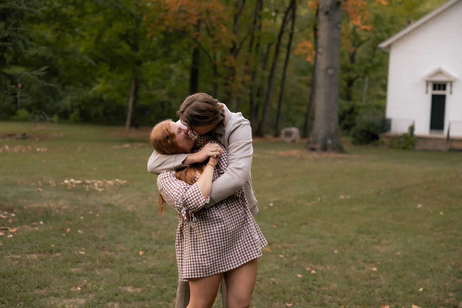 Fall outdoor golden hour engagement photos in front of chapel in Funks Grove, Illinois