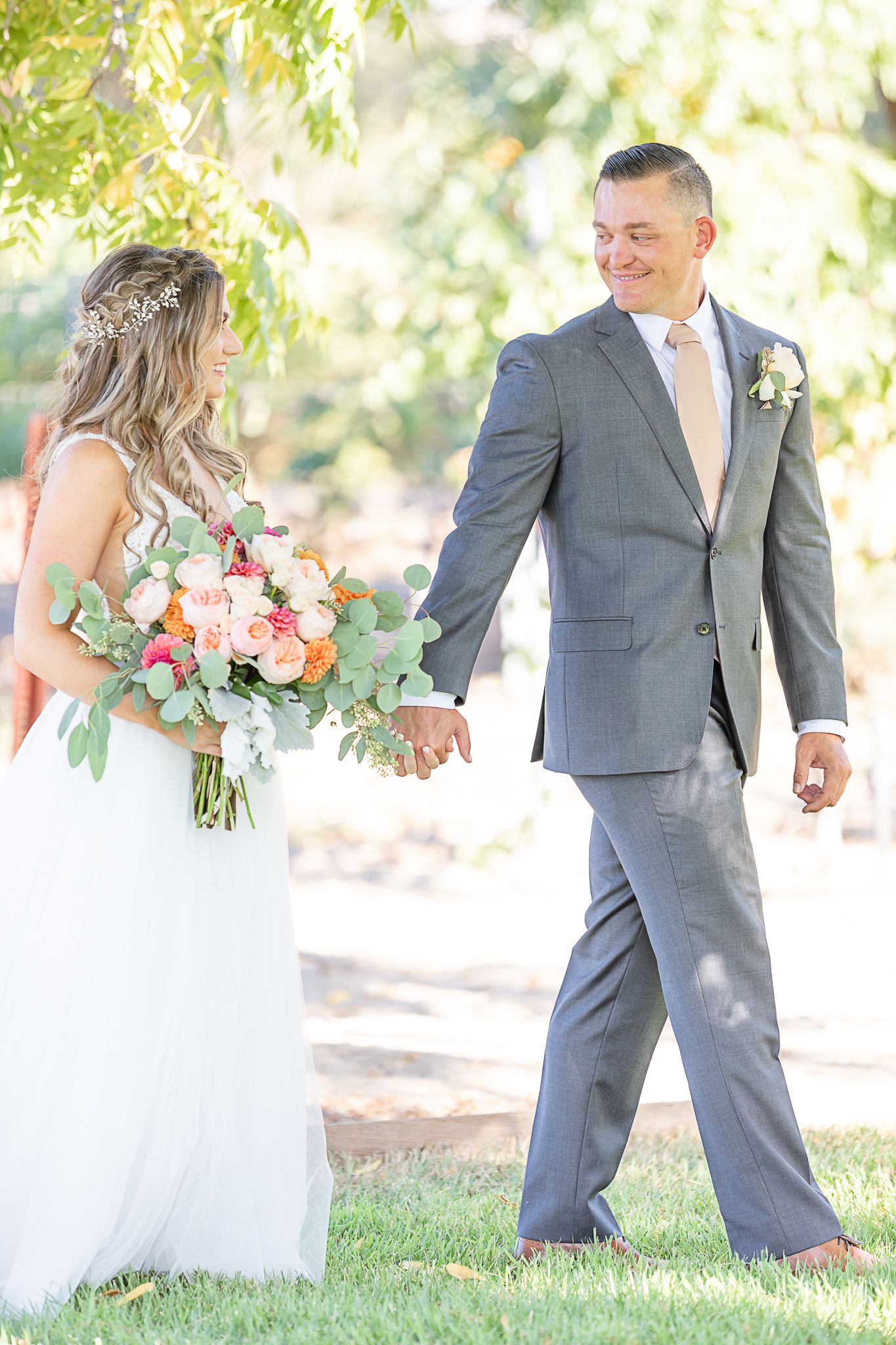 holding hands with bouquet wedding