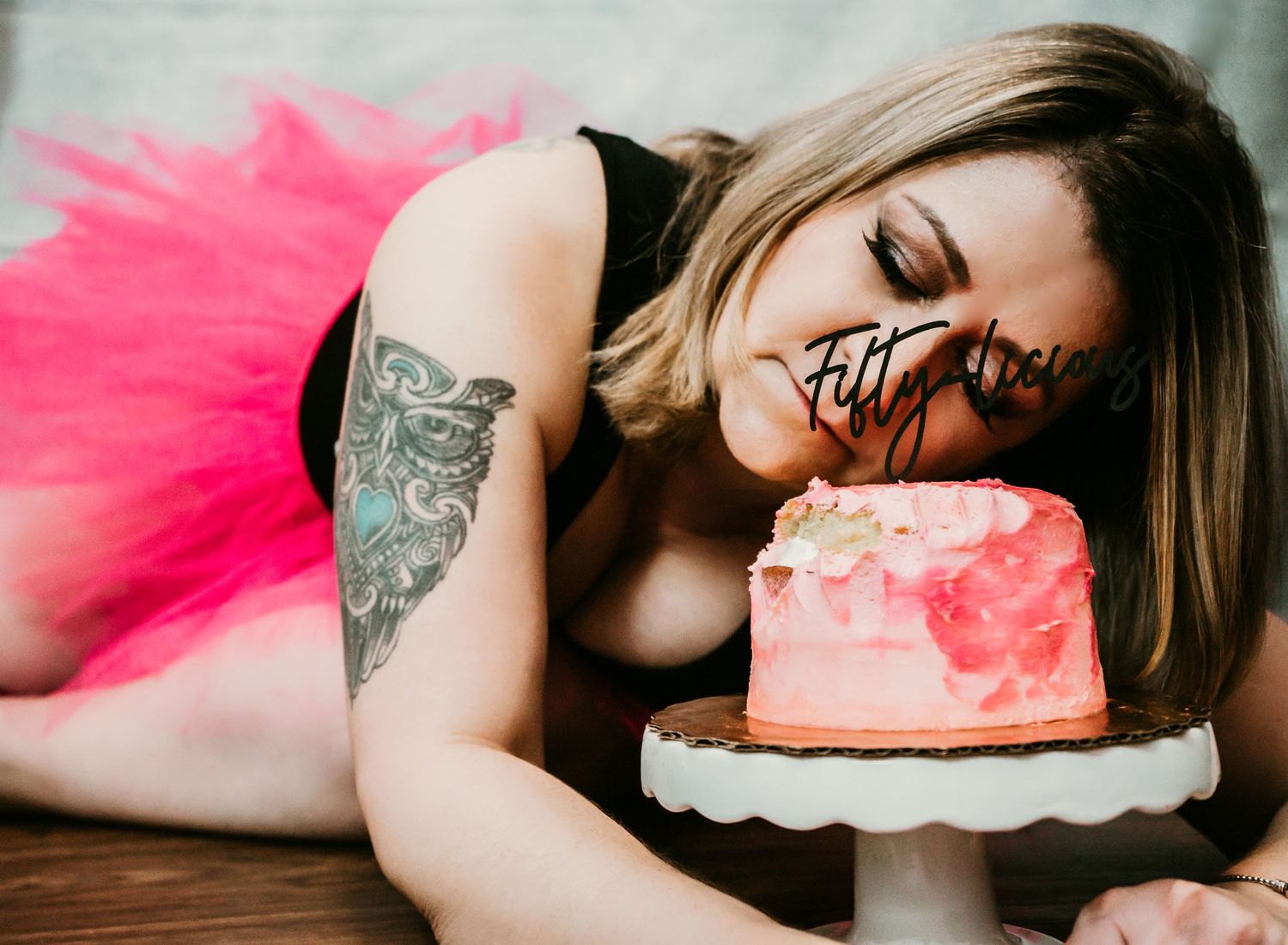 Studio Cake Smash Session in Home Ruskin, FL; Woman laying down sleeping on cake
