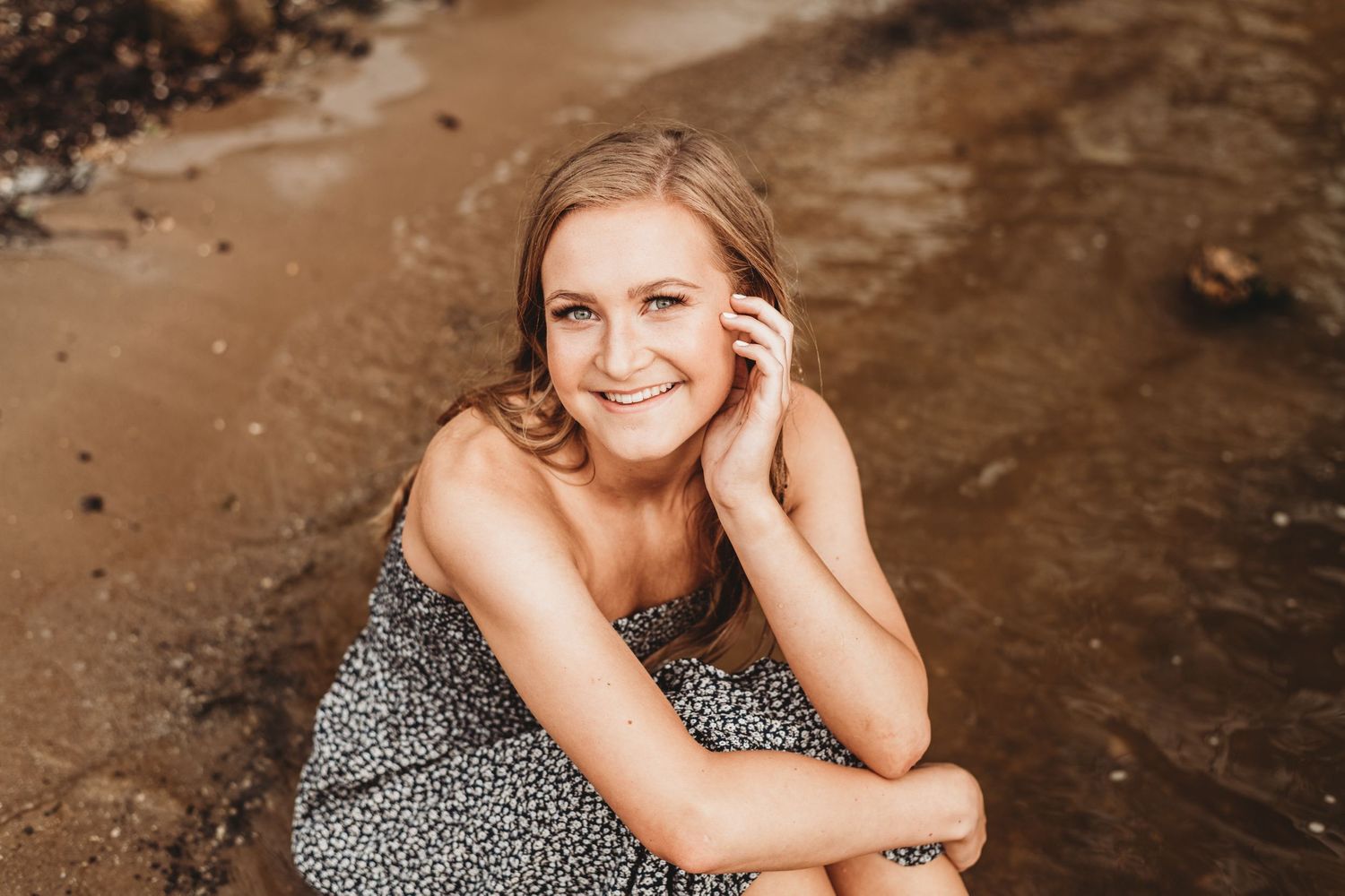 Portrait session in a rustic setting with warm lighting and brown tones.