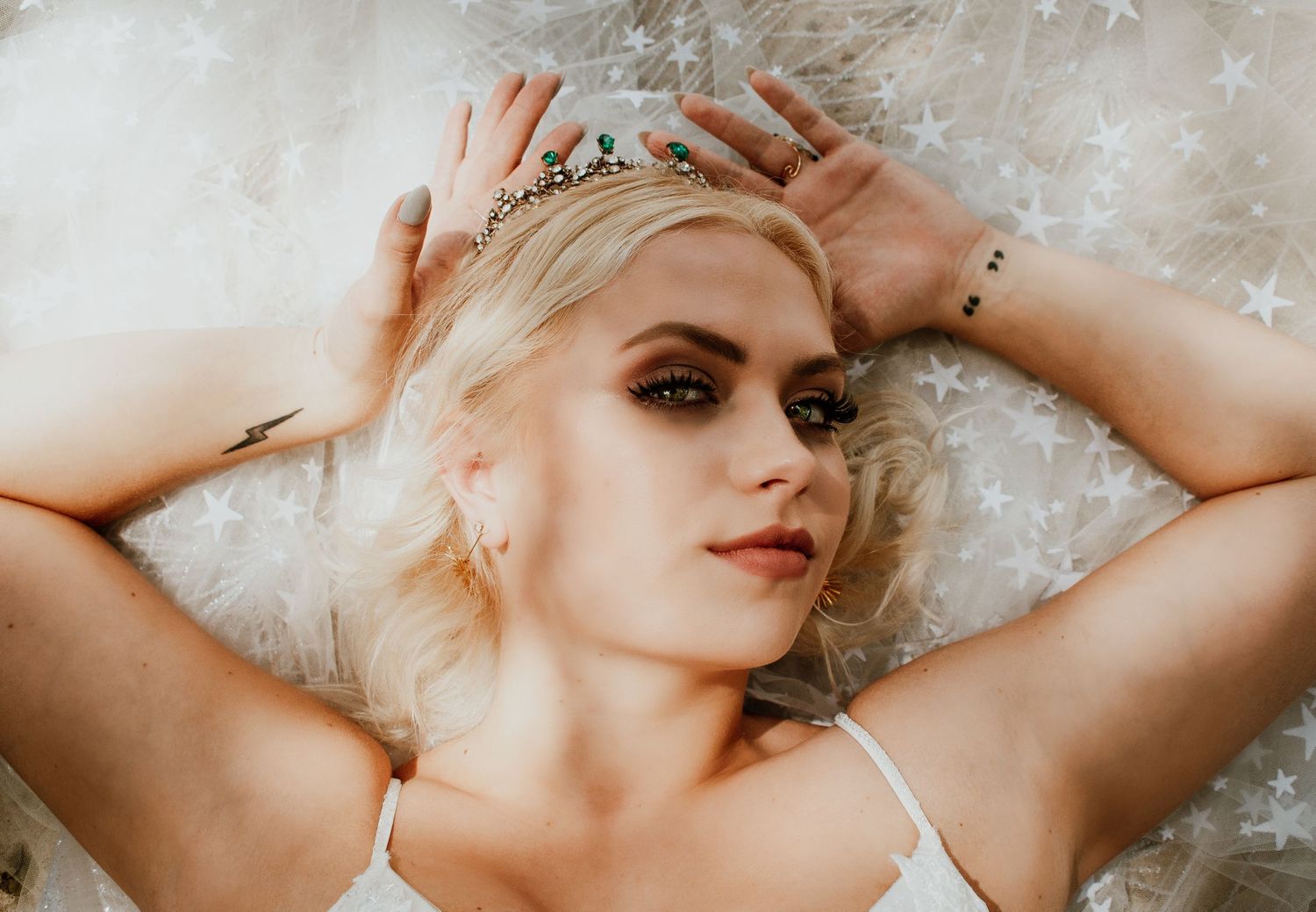 Artistic boudoir photography with ethereal winter-themed overlay effects.