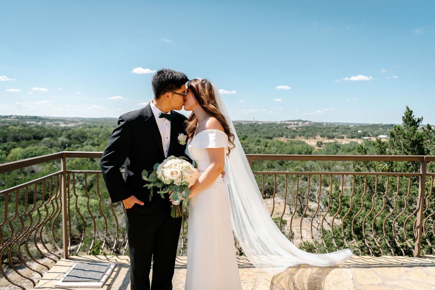 Bride & Groom standing at Chapel Dulcinea in Austin, Texas, posing for a photo after their wedding