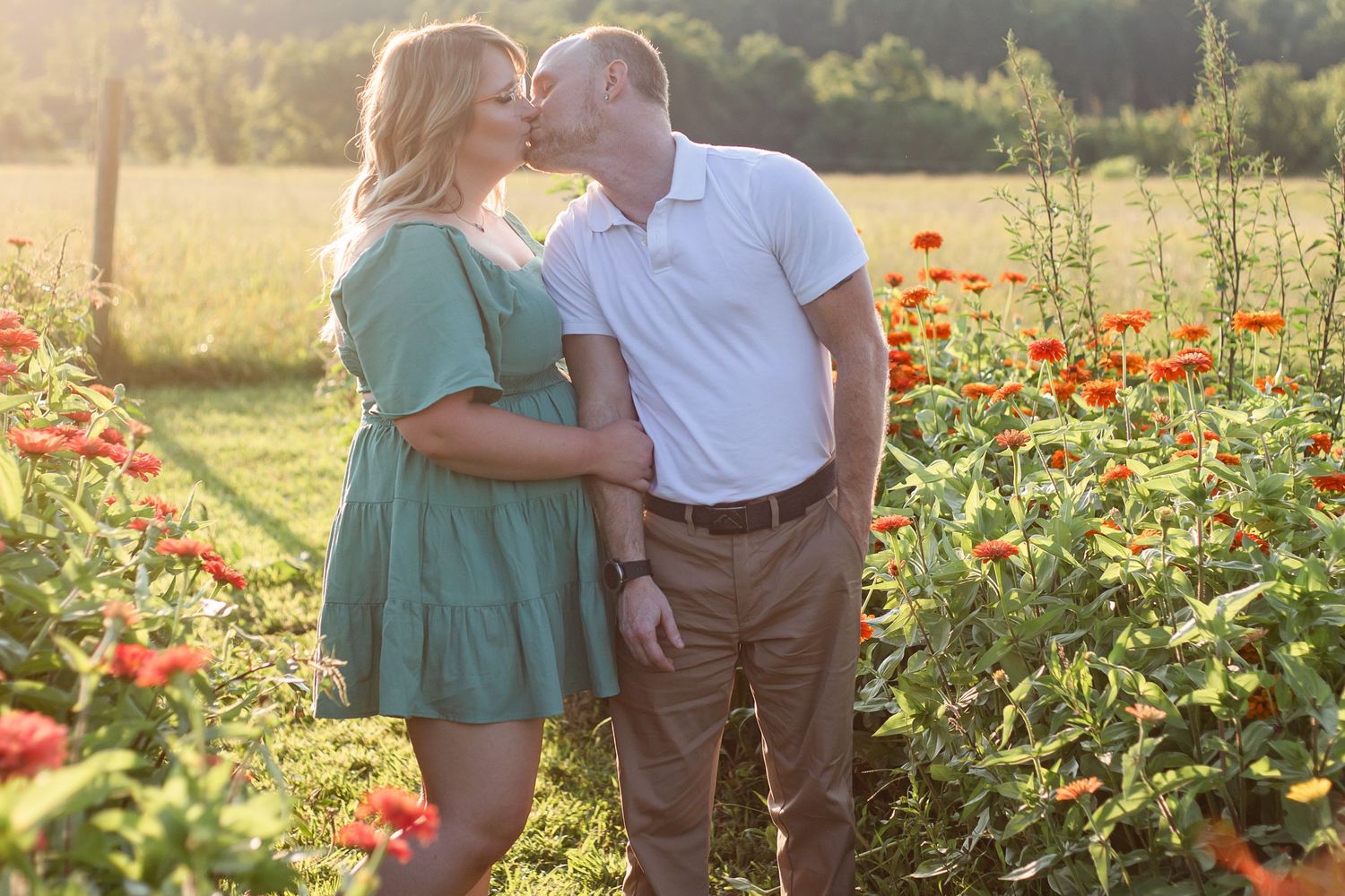 Romantic sunset photoshoot in a field of red poppies.