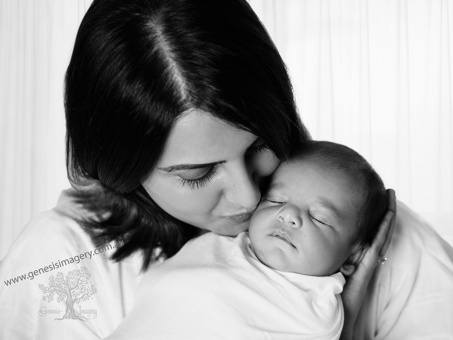 First-time parents with newborn baby in a luxury Gold Coast photography studio.