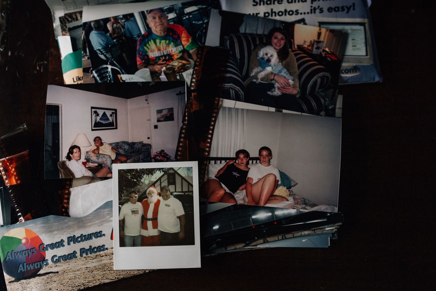 old film prints scattered on the table with film negatives