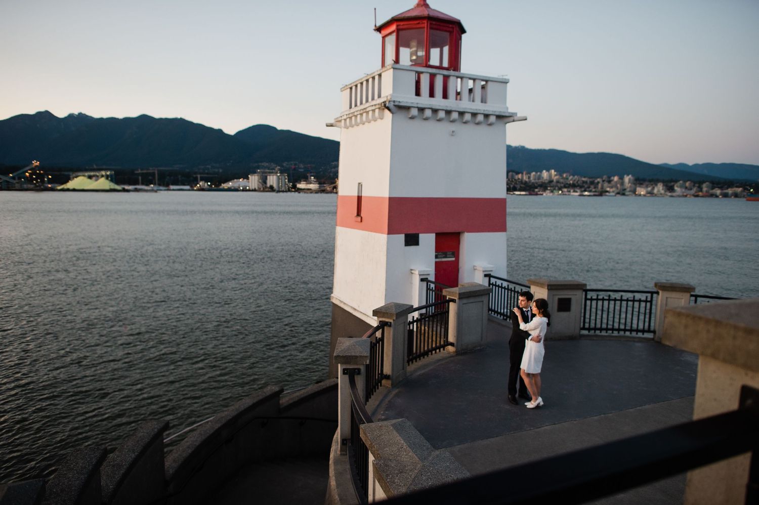 wedding couple standing by the lighthouse