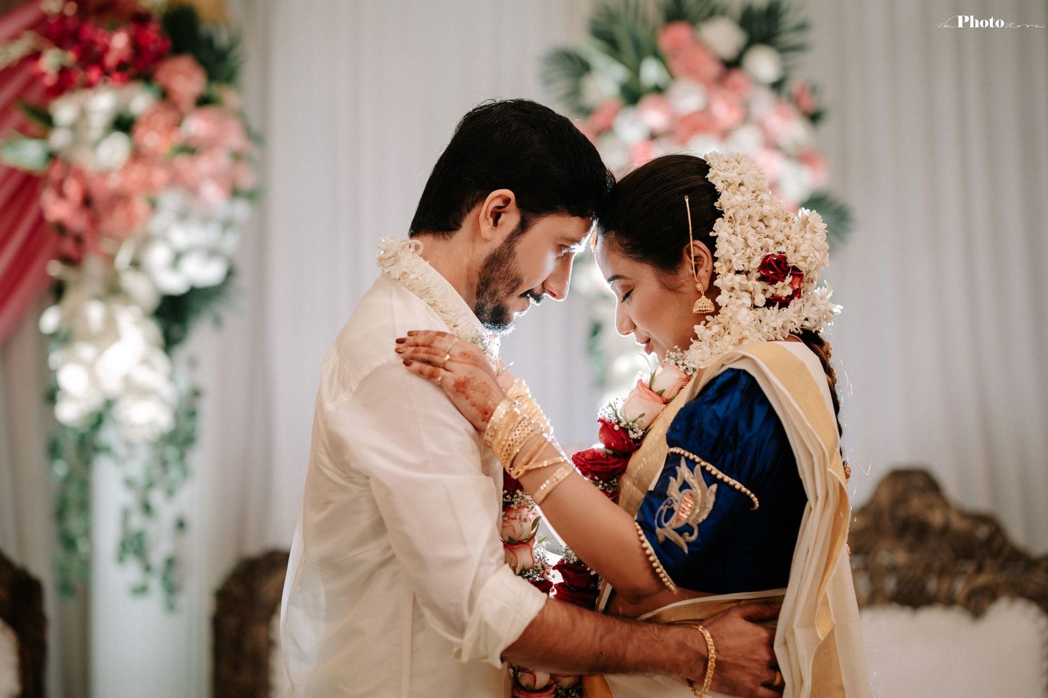 Traditional South Asian wedding ceremony with couple in ornate cultural attire.