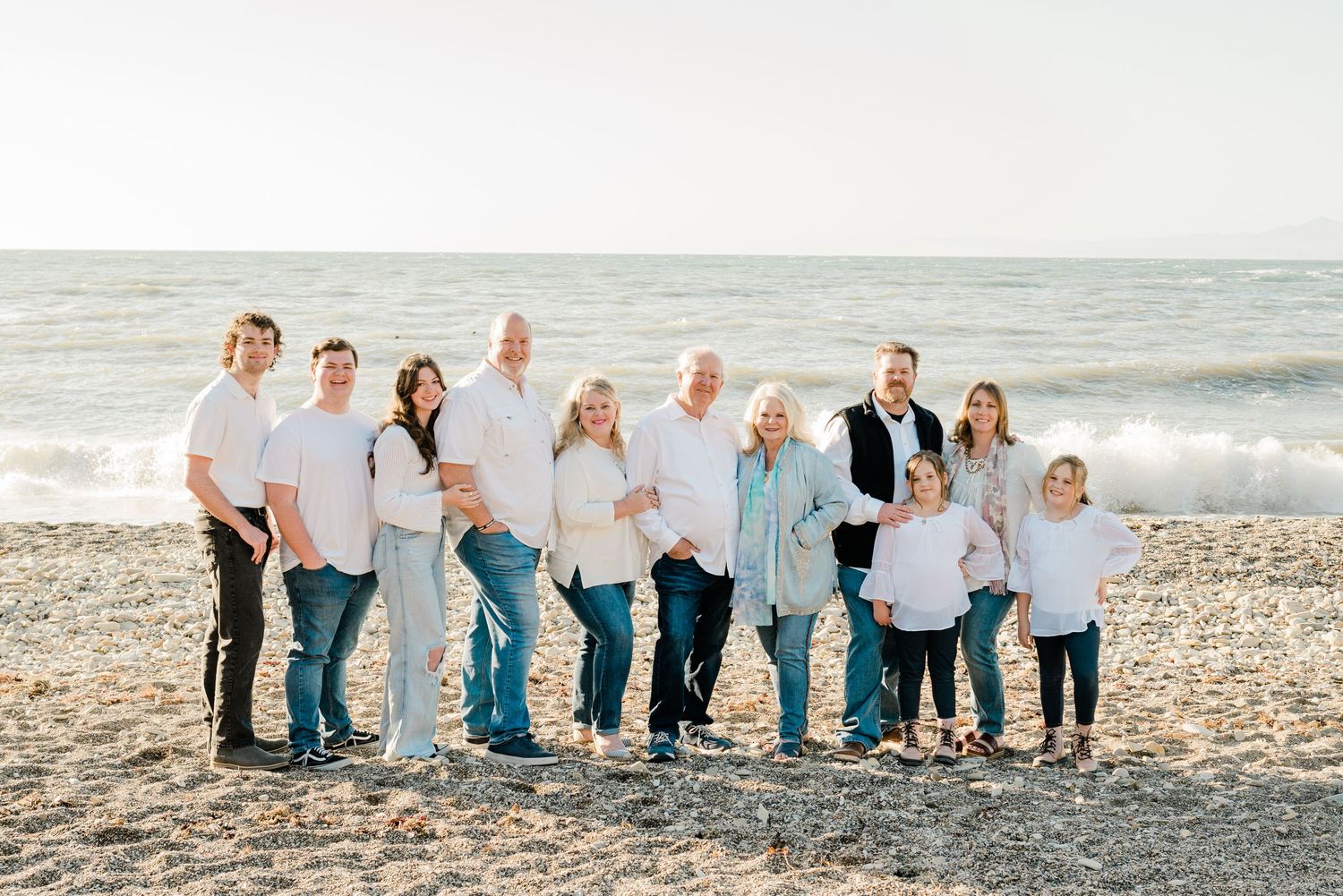 extended family session at Montana de Oro in white and denim
