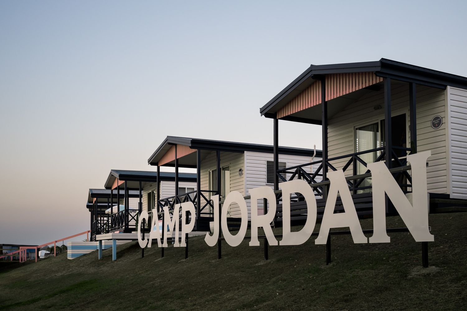 Camp Jordan picture of cabins and big sign