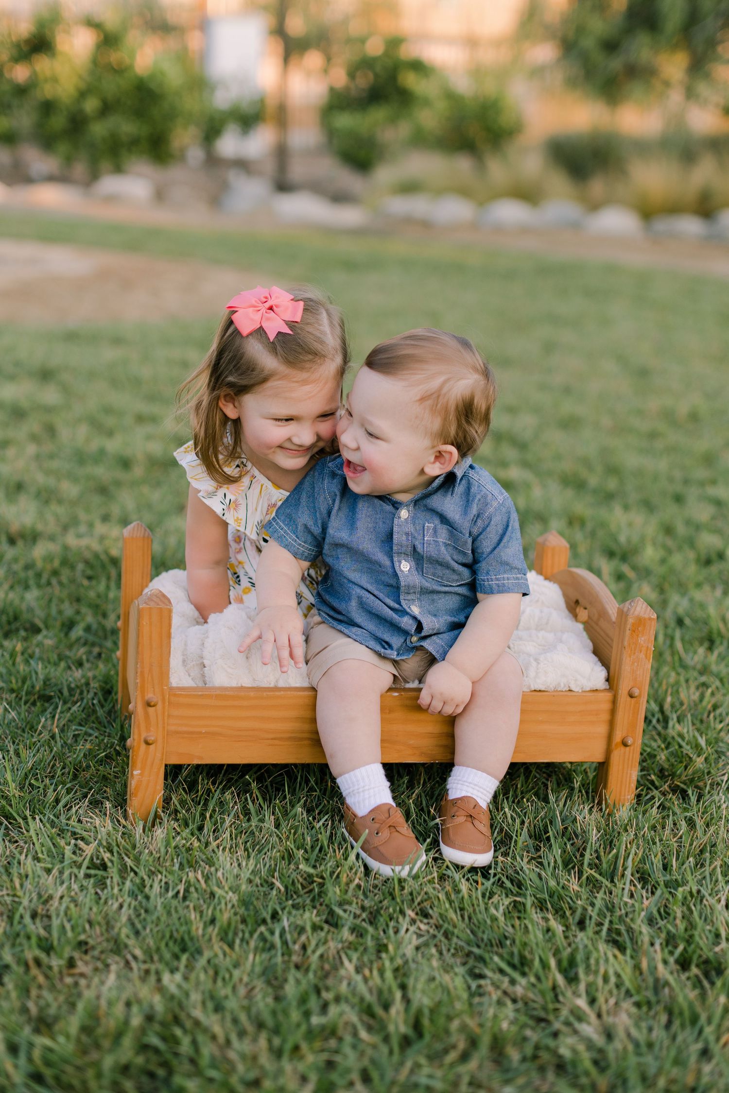Sister Brother toddlers snuggling at photo shoot