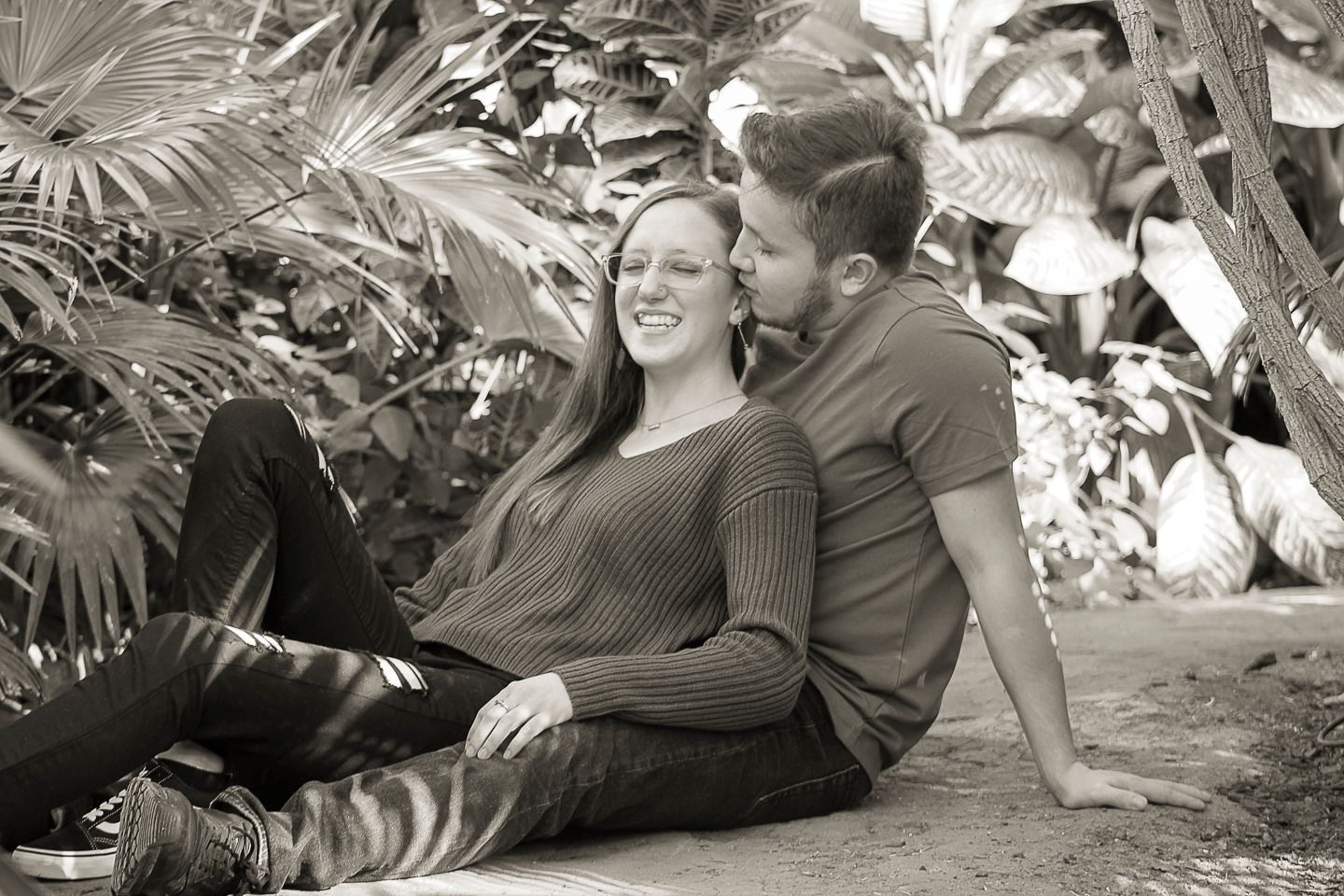 A couple during an engagement photo session at the Botanical Gardens in Amarillo, Texas