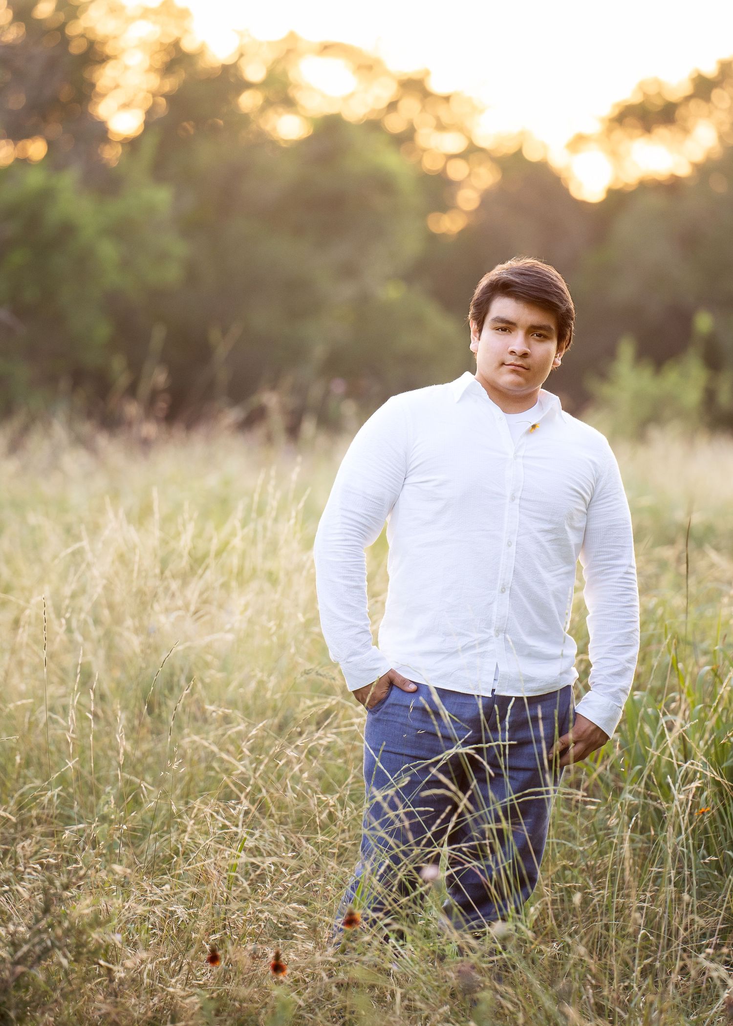 Phil Hardberger Park San Antonio Texas high school senior boy standing in field of tall grasses