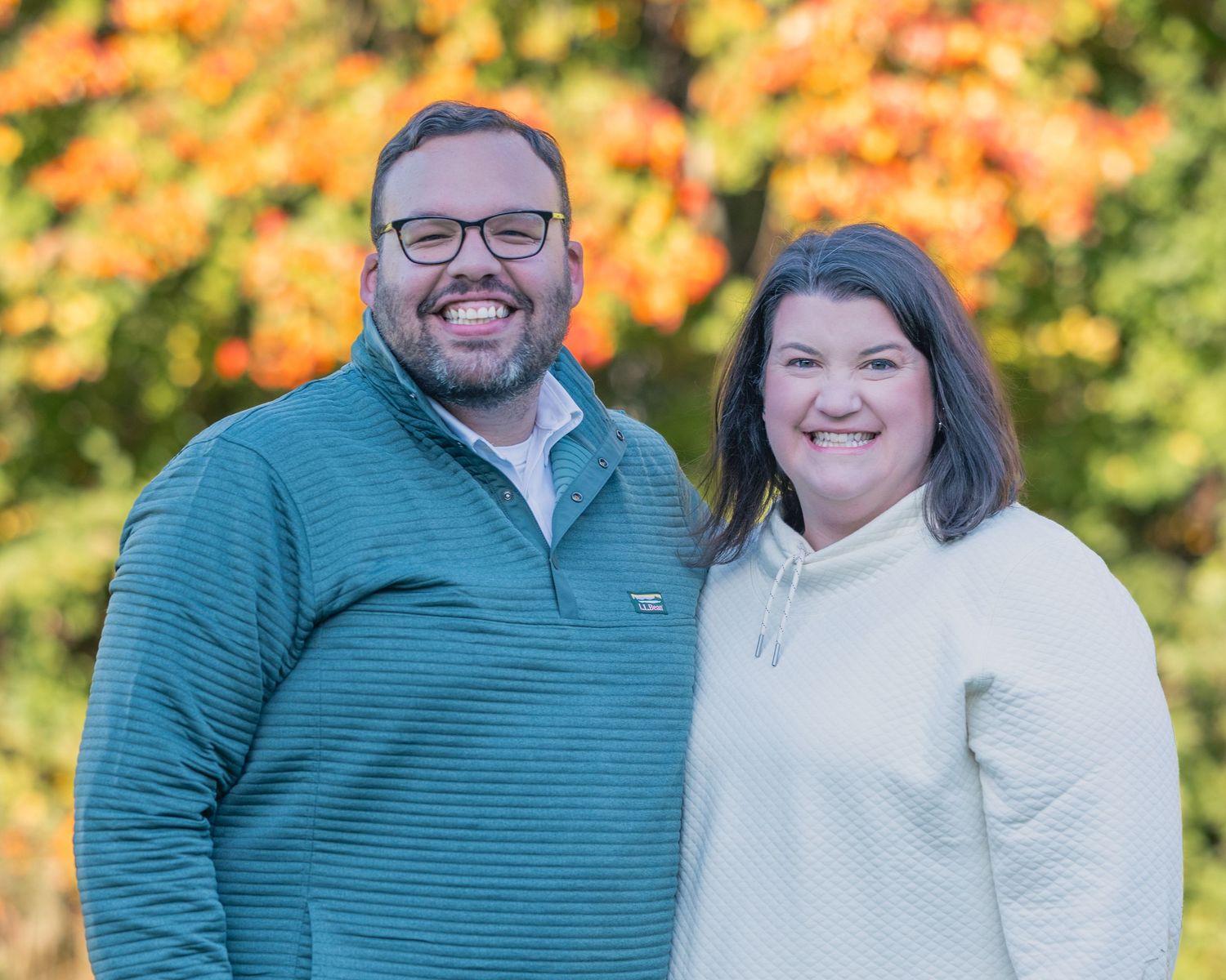 Family poses for fall family photograph