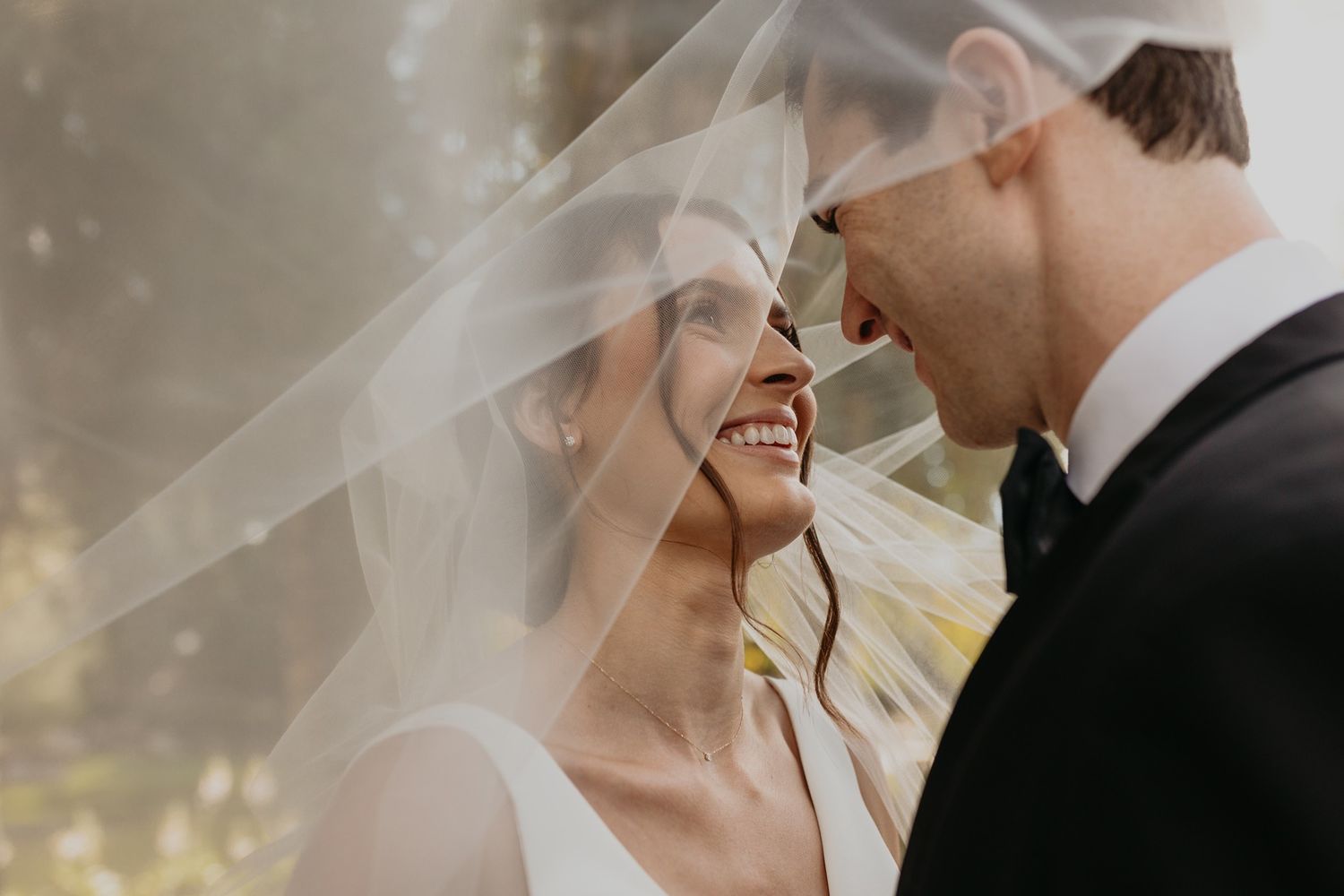 Close-up shot of a couple sharing an intimate moment during their wedding day at Lake Oak Meadows in Temecula.