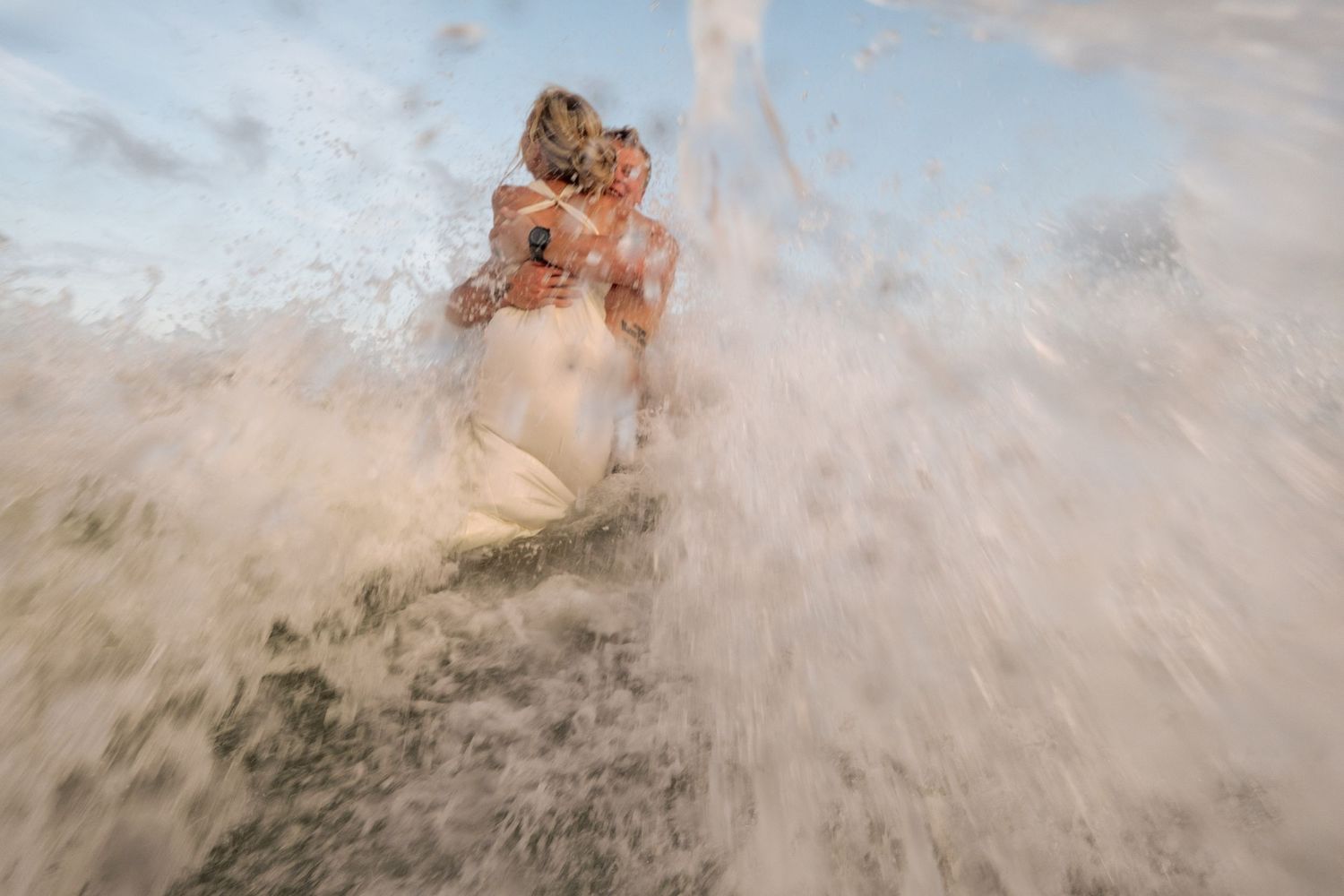 under water photos of couples gettin engaged on the beach | pink penguin studios