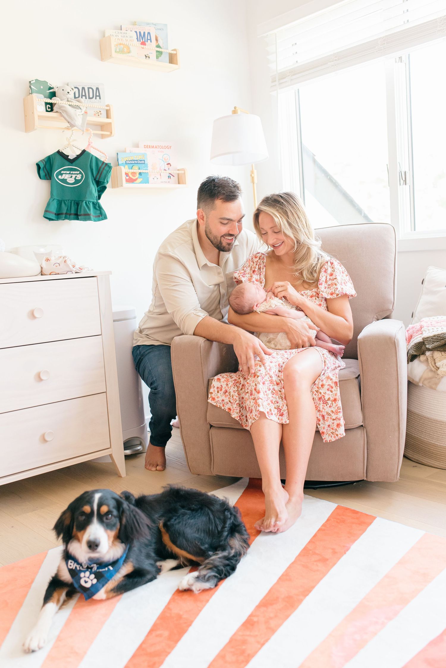 A colts neck New Jersey couple holds their new baby girl in her nursery as Lauren Marie Photography captures their first moments.
