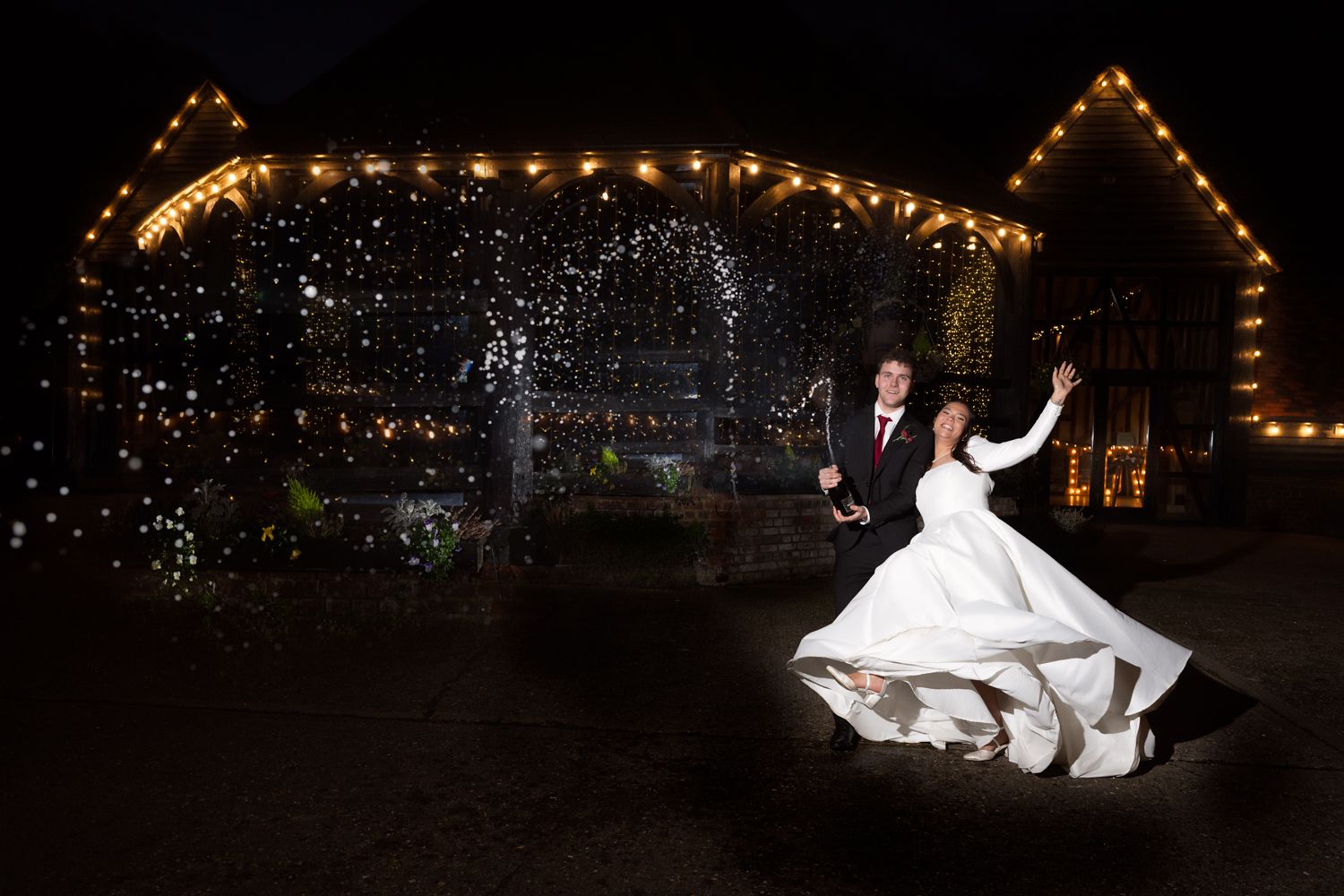 A series of wedding photos at night showing a couple dancing and celebrating under twinkling lights and decorations.