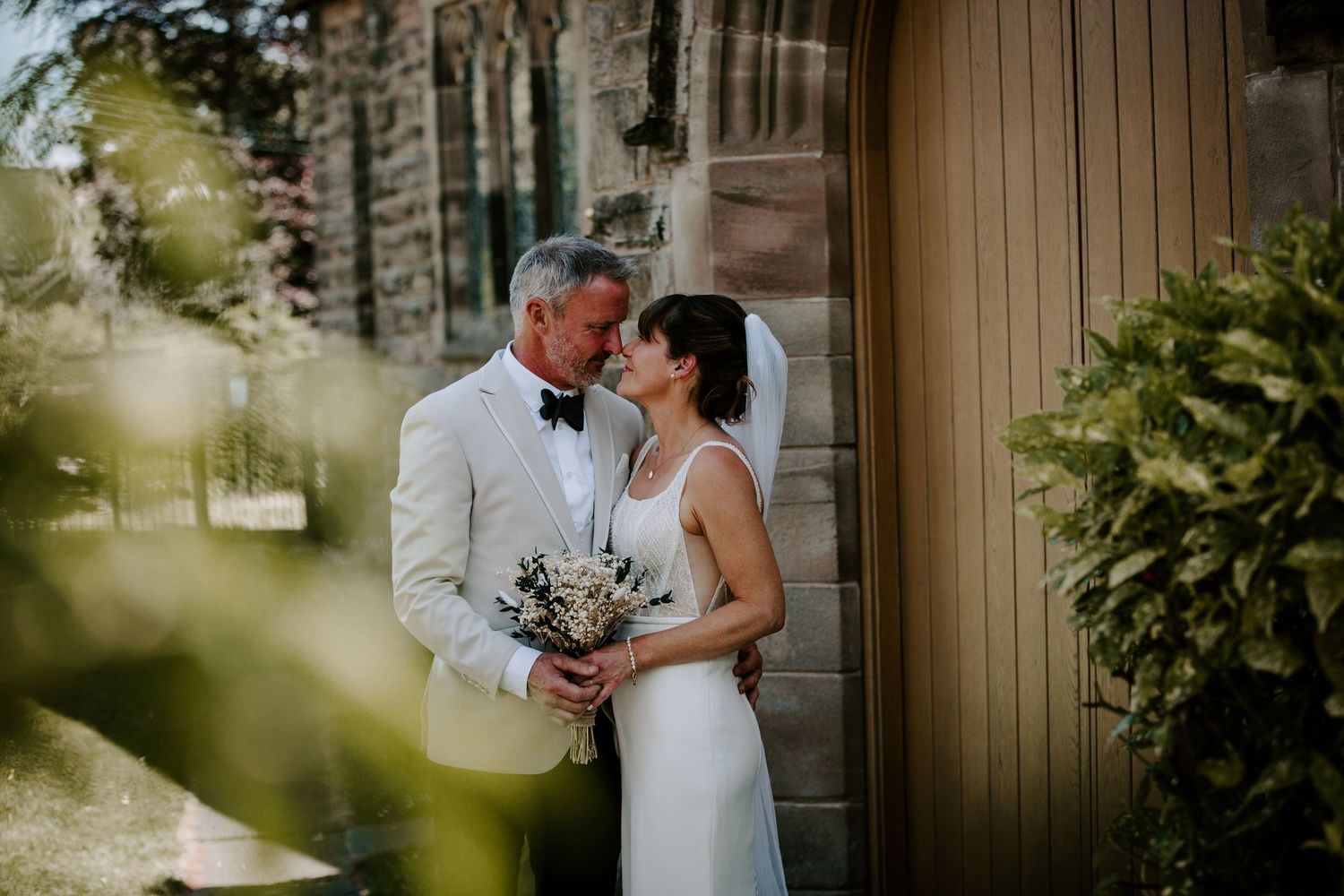 Black and white candid wedding moments captured during reception celebrations.