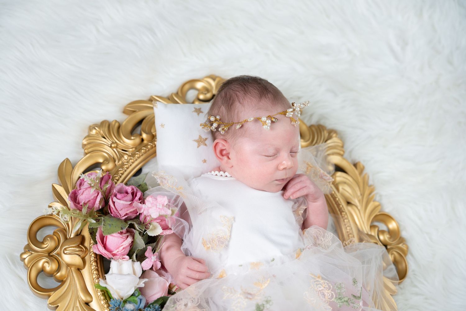 Cute newborn baby captured at a professional photography studio Dubai.