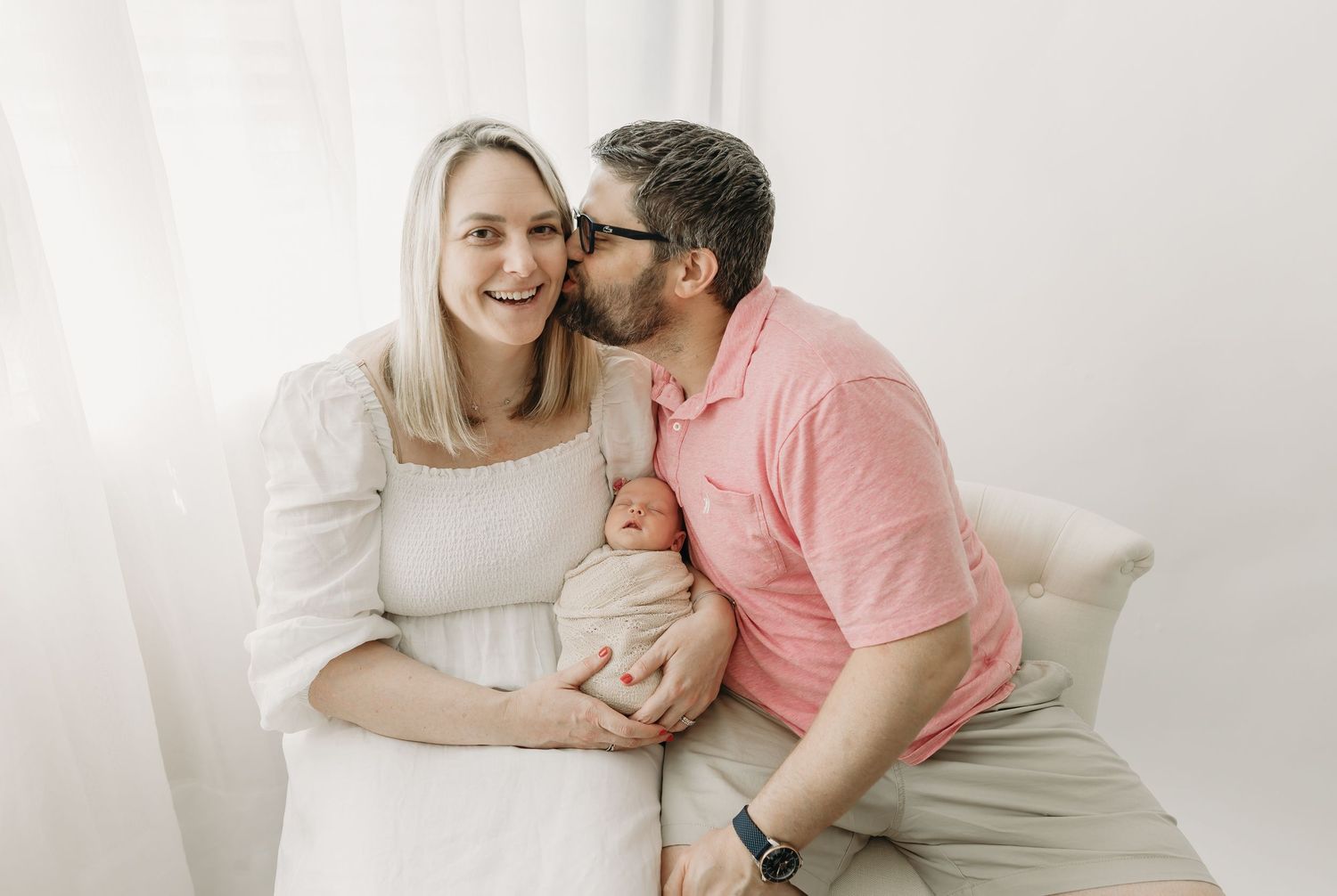 A series of intimate family photography portraits with parents snuggling their newborn baby in soft, natural light.