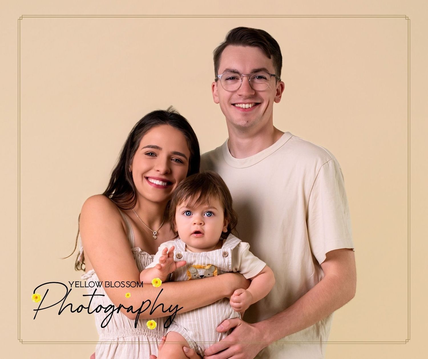 Mum & Dad cuddling baby during Moments in Bloom session – Suffolk newborn photographer