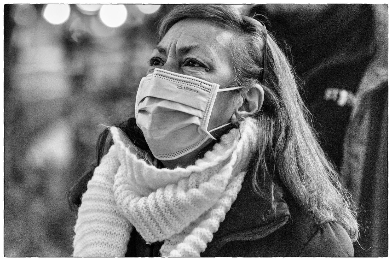 Woman listens to Congressman Seth Moulton speak at Salem's Protect The Results Rally