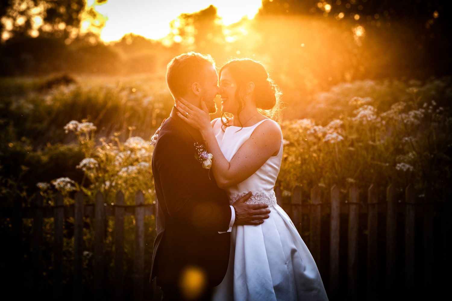 Romantic sunset silhouettes against golden light with lens flare effects.