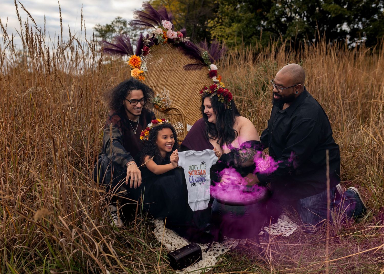 Outdoor photoshoot with purple smoke effects in tall autumn grass.