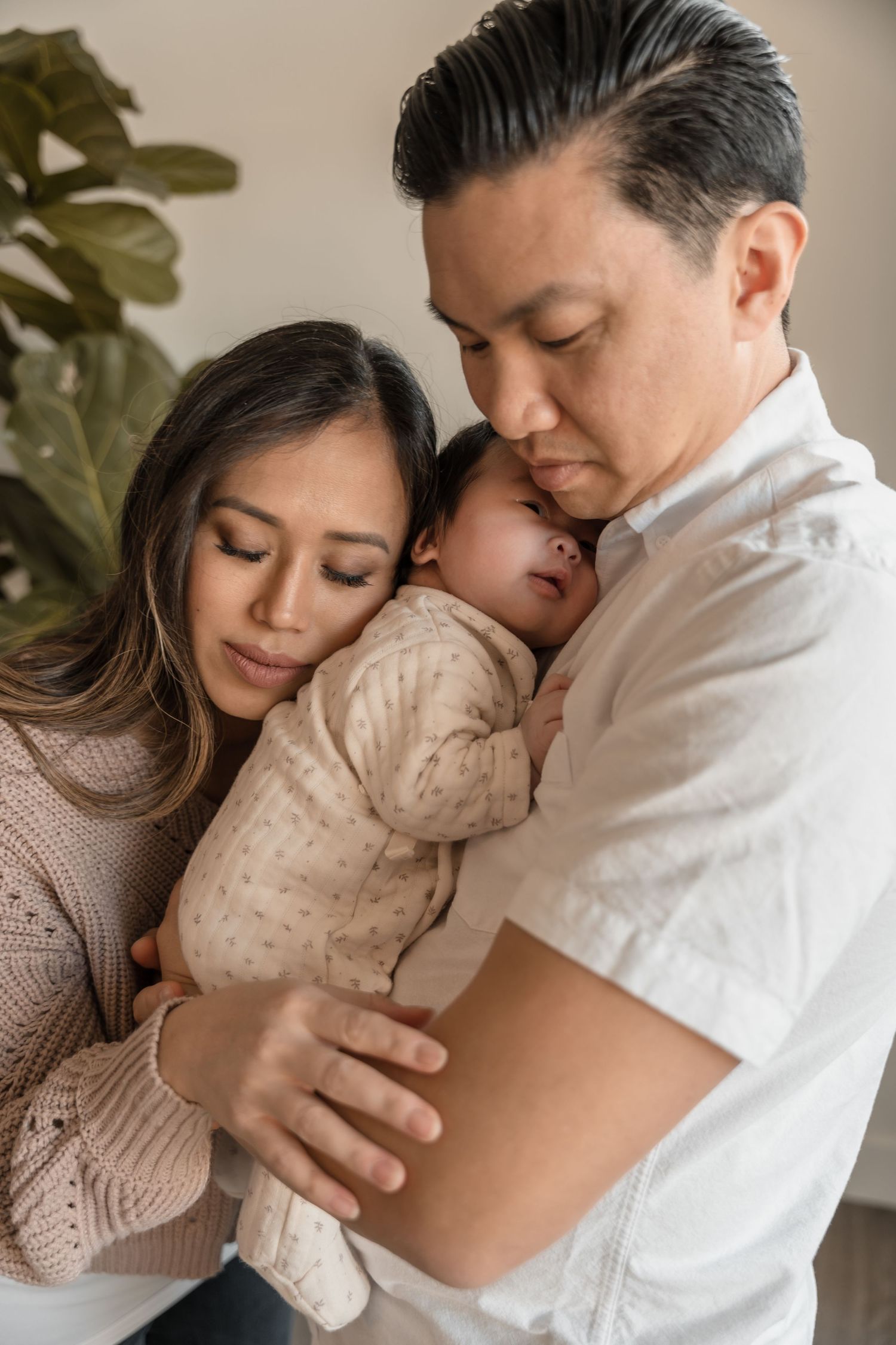 Baby Lyra in newborn photoshoot session in-home lifestyle with warm tones