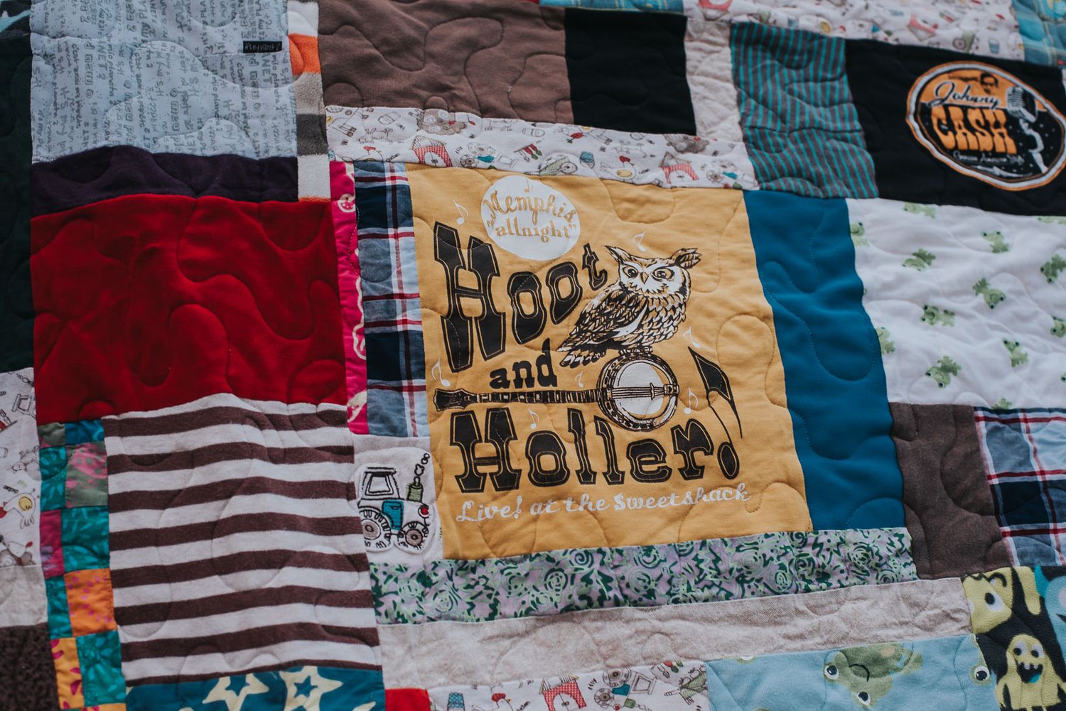 Hoot and Holler children's shirt with a banjo and an owl is front and centre in a patchwork memory quilt.