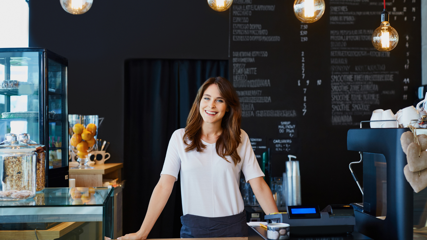 woman behind counter, coffee shop owner, female business owner